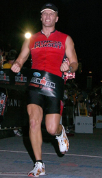 Matt Petersen crosses the finish line at Ironman Madison!