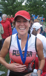 Janet smiles for her family as she starts her favorite part of the triathlon!